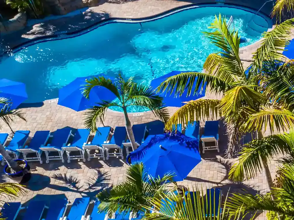Pool with cabanas and loungers